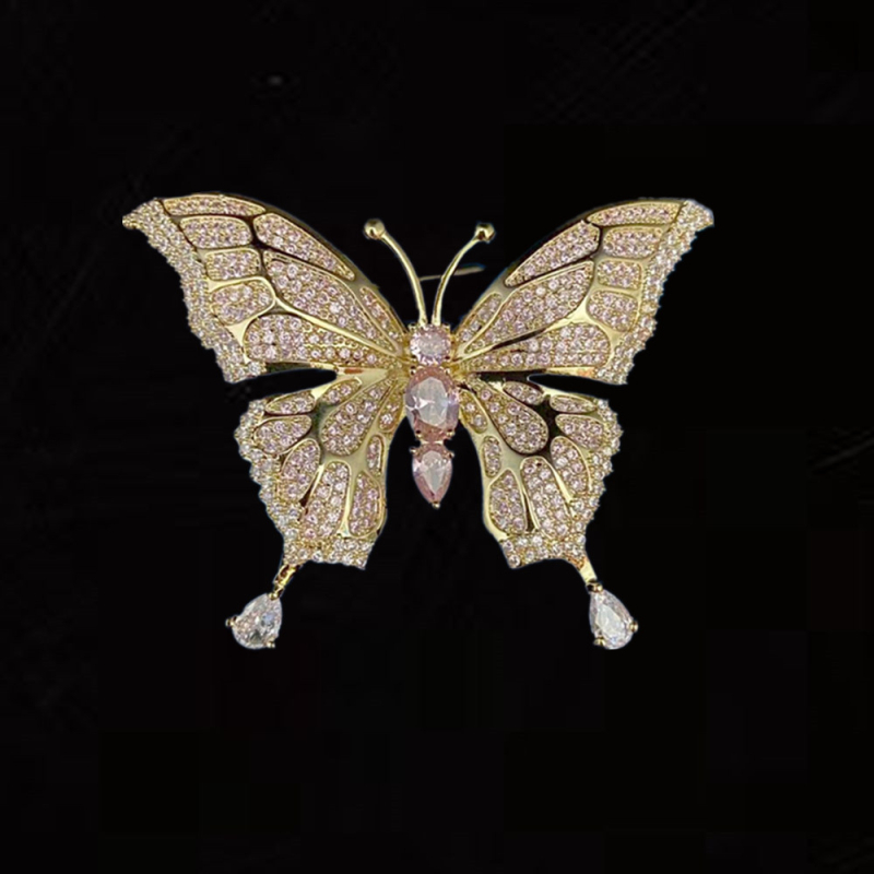 Réz alapú pillangó bross cirkóniával díszített, női divat kiegészítő, fémbe bevonva