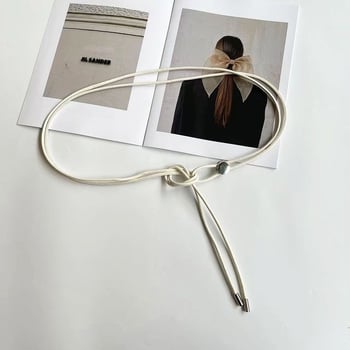 Mesterséges bőrből készült öves ruha, övcsat anyaga ötvözet, zárás tűcsattal, öv szélessége 2 cm alatt, kód A12051