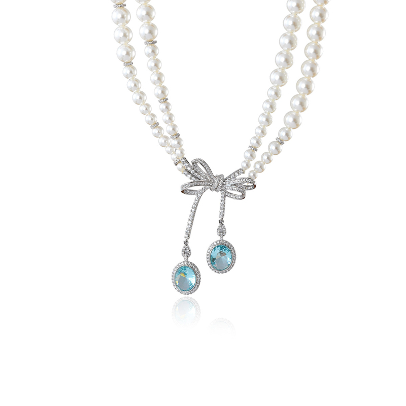 Κολιέ με σχήμα φιόγκο, ηλεκτροπλατιωμένο χαλκό-κράμα, μενταγιόν με ζιρκόν, μαργαριταρένια αλυσίδα