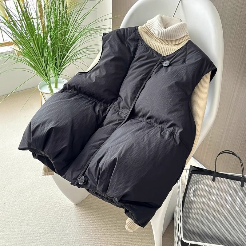 Γυναικείο γιλέκο με γέμισμα πολυεστέρα-βαμβάκι, κοντό, χαλαρή γραμμή (γέμισμα: πολυεστέρας-βαμβάκι; ύφασμα: πολυεστέρας; μήκος: 50–65 εκ.)