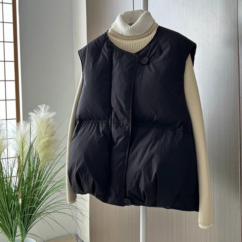 Γυναικείο γιλέκο με γέμισμα πολυεστέρα-βαμβάκι, κοντό, χαλαρή γραμμή (γέμισμα: πολυεστέρας-βαμβάκι; ύφασμα: πολυεστέρας; μήκος: 50–65 εκ.)