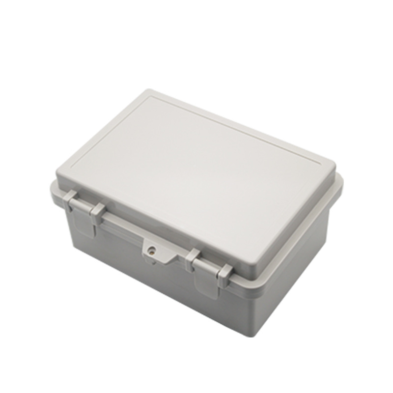 Vodotesná ABS rozvodná skrinka s výklopným krytom na pántoch, uzamykateľná, pre vonkajšiu kabeláž.