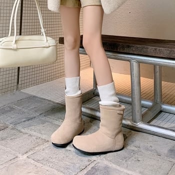 Sieviešu īsās ziemas zābaki no velūra ar integrētu kažokādas iekšpusi, zems šahts, apaļš purns, plakanais papēdis 1–3 cm