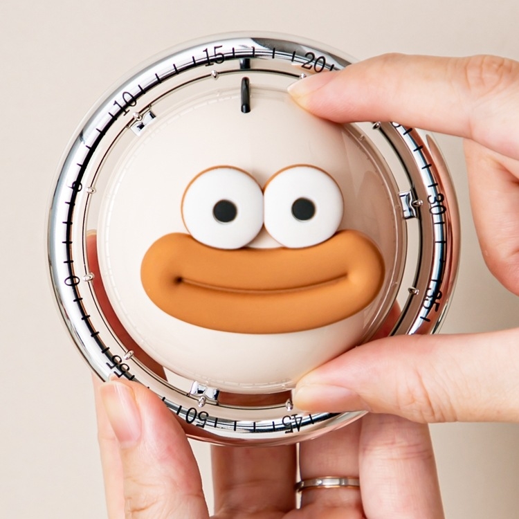 Mechanický kuchynský časovač s ukazovateľom, guľatý vzhľad, napájaný batériou – na varenie a pečenie