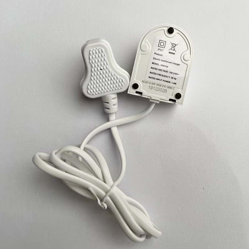 HX6100 brit szabványú elektromos fogkefetöltő – indukciós töltés, töltőalap, 100-240V, 1.4W, tömeg 75 g