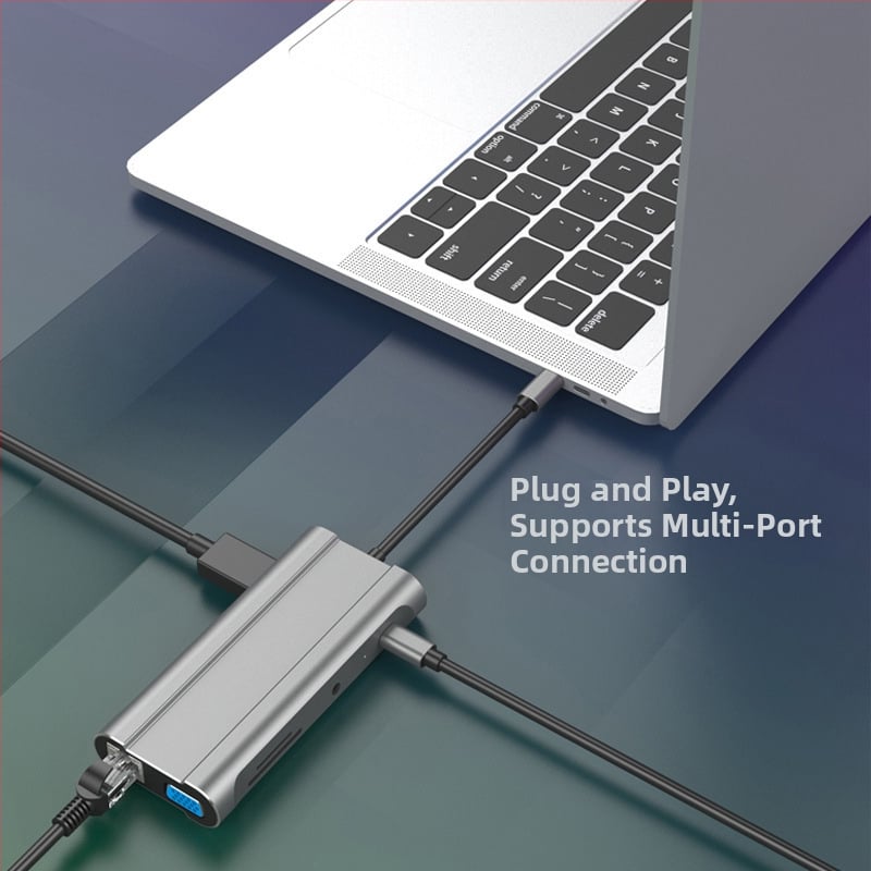USB-C rozširovací dok s 3× USB 3.0 porty, SD/TF čítačky kariet, HDMI a VGA, Gigabit Ethernet