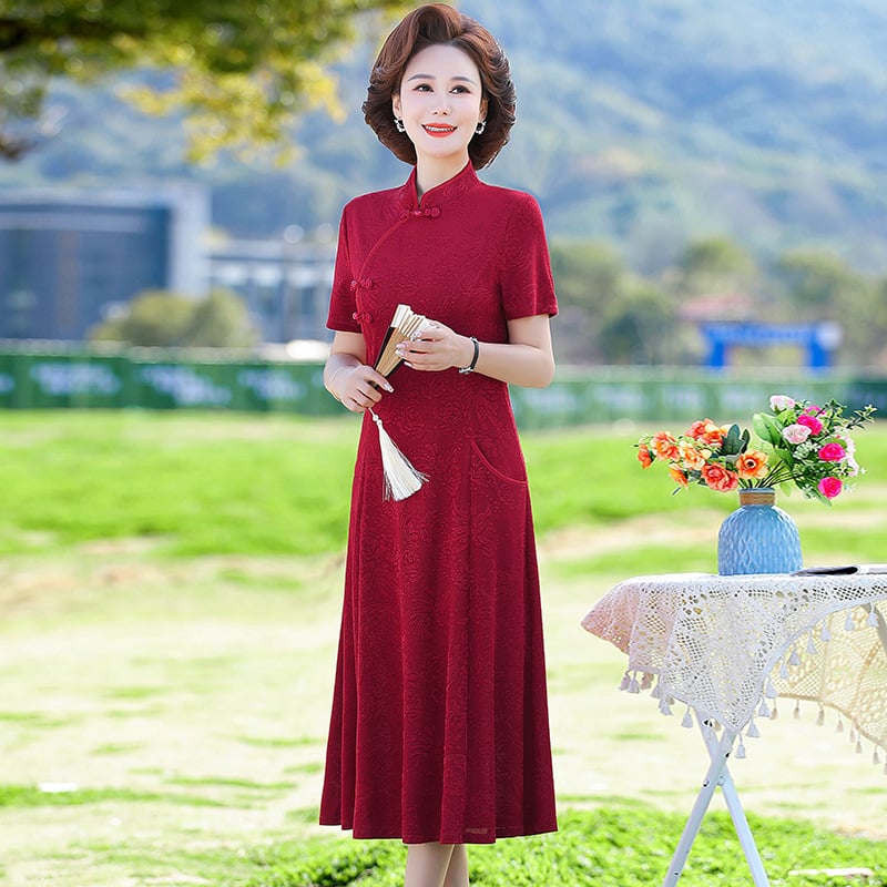 Ženska haljina s Tencel mješavinom (70-80%) i poliestera (30-50%), midi duljina, A-silueta, stojeći ovratnik, kratki rukavi