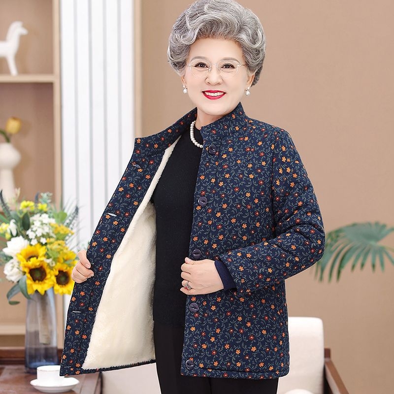 Dámska vyteplená bunda s polo golierom, voľný strih, stredná hrúbka, TR tkanina na PVC podklade, výplň z imitácie hodvábu a bavlny.