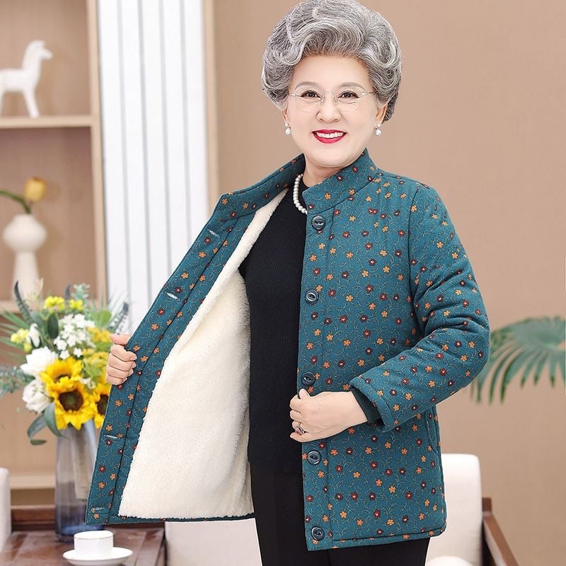 Dámska vyteplená bunda s polo golierom, voľný strih, stredná hrúbka, TR tkanina na PVC podklade, výplň z imitácie hodvábu a bavlny.