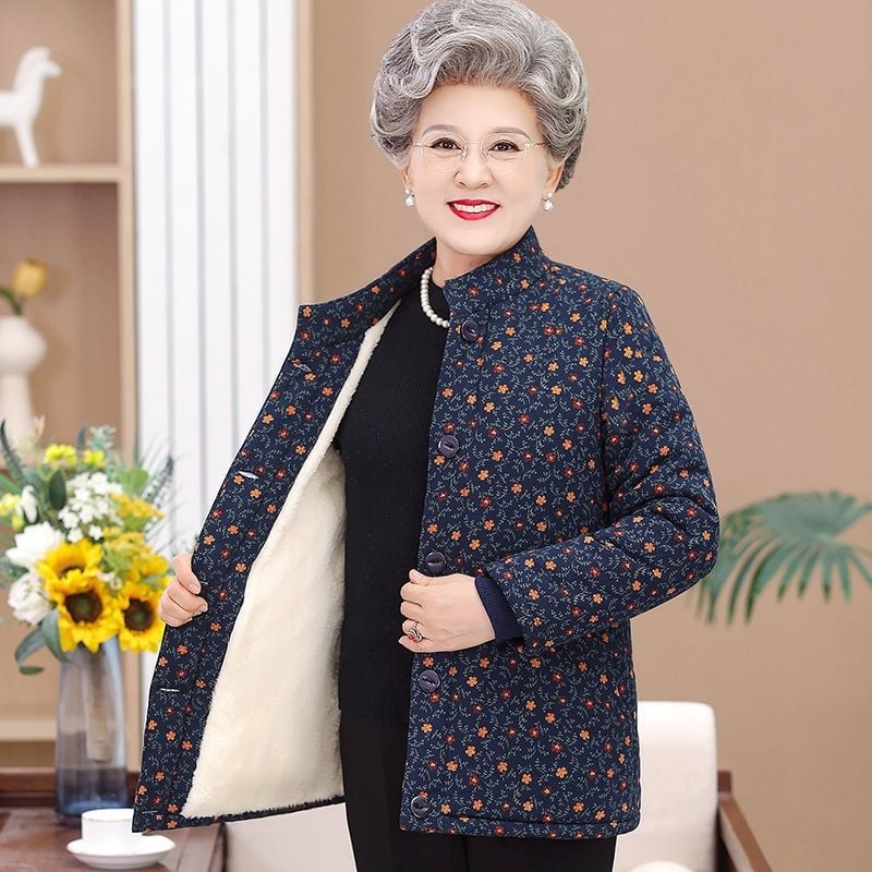 Dámska vyteplená bunda s polo golierom, voľný strih, stredná hrúbka, TR tkanina na PVC podklade, výplň z imitácie hodvábu a bavlny.