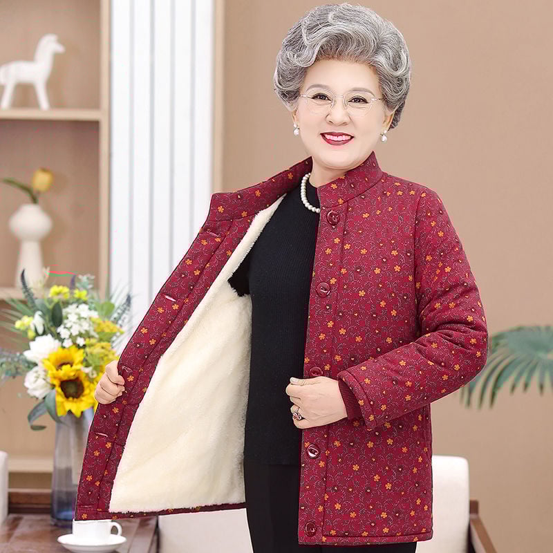 Dámska vyteplená bunda s polo golierom, voľný strih, stredná hrúbka, TR tkanina na PVC podklade, výplň z imitácie hodvábu a bavlny.