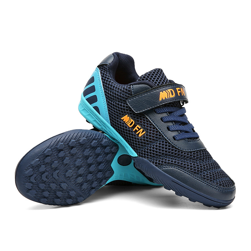 Παιδικά παπούτσια ποδοσφαίρου με Velcro κούμπωμα, διαπνέον εσωτερικό από πλέγμα, άνω μέρος από συνθετικό δέρμα, χαμηλό κόψιμο, αντιολισθητική σόλα από καουτσούκ