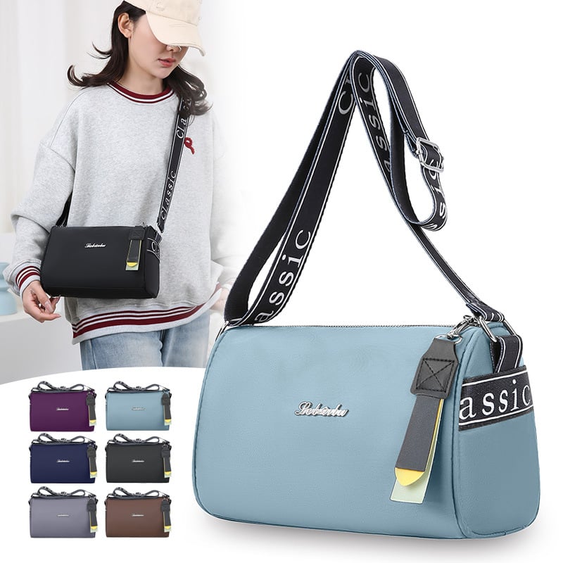 Crossbody torba u obliku jastuka od Oxford tkanine, zatvaranje na zip, jednostruka naramenica, unutarnji džepovi sa zatvaračem