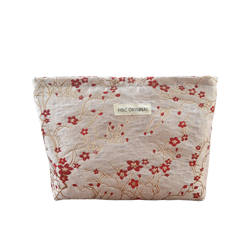 Ženska prijenosna kozmetička torbica s reljefnim cvjetnim uzorkom, poliester, podstava od platna, putni organizator