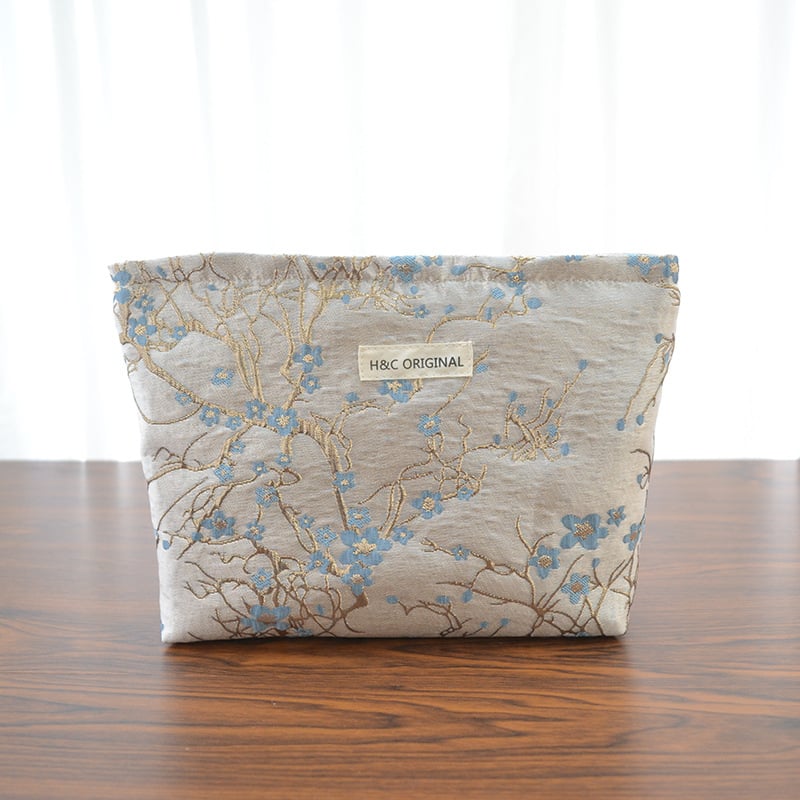 Ženska prijenosna kozmetička torbica s reljefnim cvjetnim uzorkom, poliester, podstava od platna, putni organizator