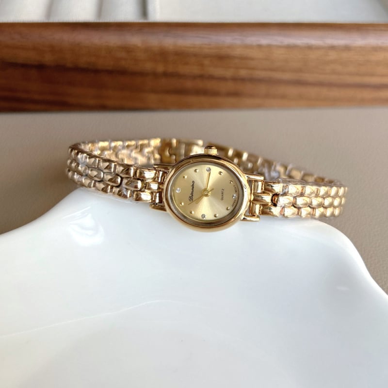Női vintage óra ovális réz szíjjal, kvarc mozgatás (japán Miyota), fém tokkal, 30M vízálló
