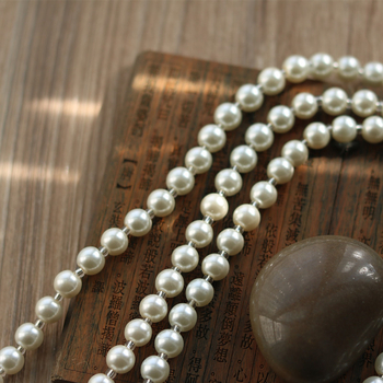 Kétszálú gyöngy pulóverlánc – virágmotívum, nőies retro stílus, sütőfényezés