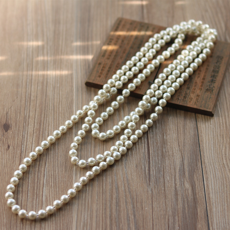 Kétszálú gyöngy pulóverlánc – virágmotívum, nőies retro stílus, sütőfényezés