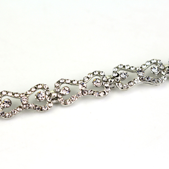 Narukvica od legure s kristalima ugraviranima i umjetnim dragim kamenjem, dizajn mašna