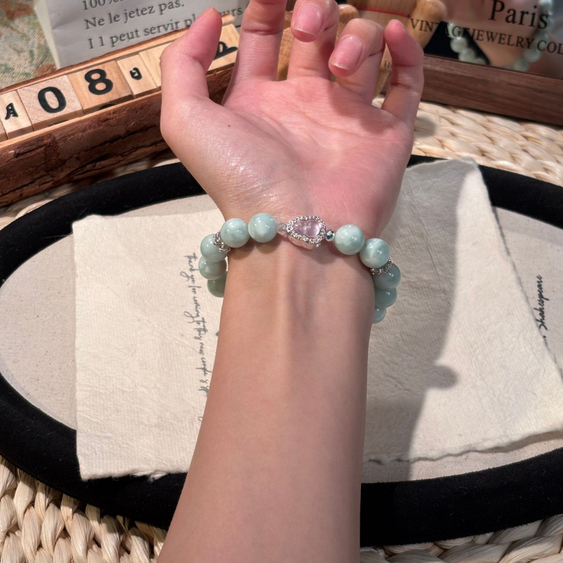 Rózsakvarc kristály karkötő, oldalkövek nélkül, Shantou eredet, divatos stílus (Kristály: rózsakvarc; Oldalkövek: nincs; Eredet: Shantou; Stílus: divat; Megjelenés: őszi 2025)