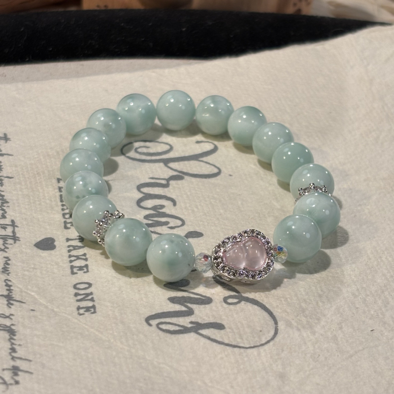 Rózsakvarc kristály karkötő, oldalkövek nélkül, Shantou eredet, divatos stílus (Kristály: rózsakvarc; Oldalkövek: nincs; Eredet: Shantou; Stílus: divat; Megjelenés: őszi 2025)