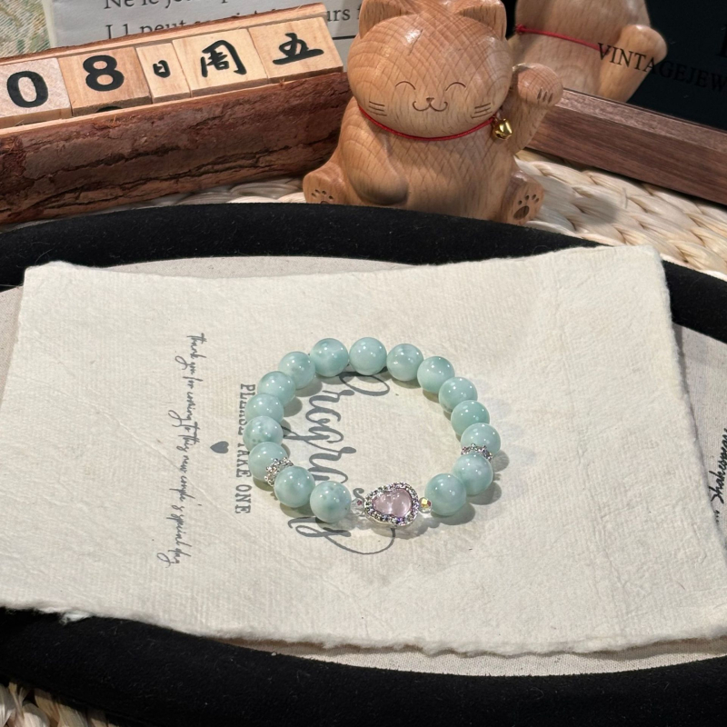 Rózsakvarc kristály karkötő, oldalkövek nélkül, Shantou eredet, divatos stílus (Kristály: rózsakvarc; Oldalkövek: nincs; Eredet: Shantou; Stílus: divat; Megjelenés: őszi 2025)