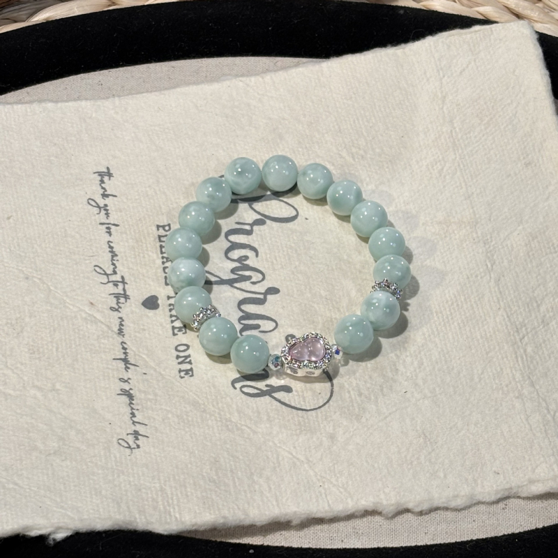 Rózsakvarc kristály karkötő, oldalkövek nélkül, Shantou eredet, divatos stílus (Kristály: rózsakvarc; Oldalkövek: nincs; Eredet: Shantou; Stílus: divat; Megjelenés: őszi 2025)