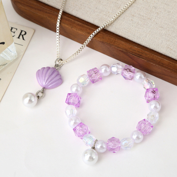 Set detského náhrdelníka a náramku — tenký reťaz, príves z imitácie perly, plast/rezín s elektrolytickým pokovením, motív animovaného hrdinu