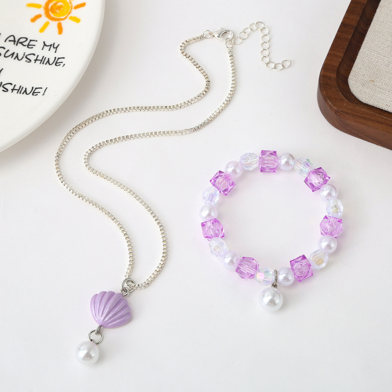 Set detského náhrdelníka a náramku — tenký reťaz, príves z imitácie perly, plast/rezín s elektrolytickým pokovením, motív animovaného hrdinu