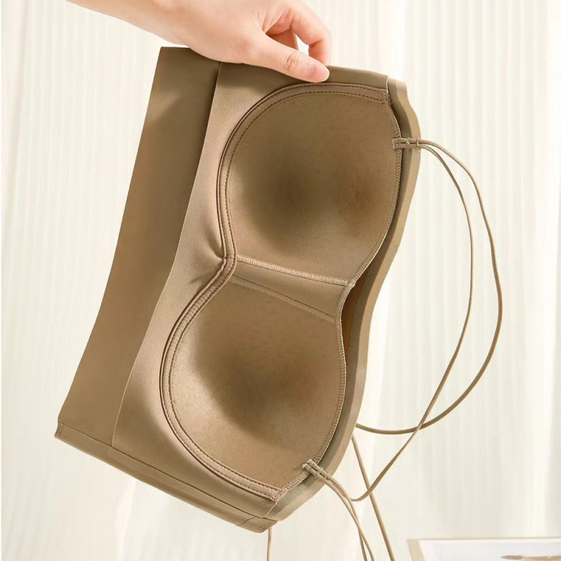 Bez plecu siksnām necaurspīdīgs ar krustu muguru, 3/4 krūšu kausi, plāni veidoti kausi, neilona audums