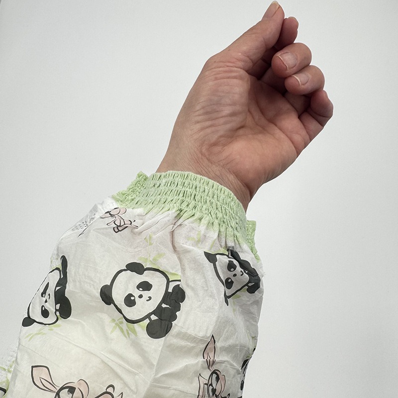 Vienkartinės vaiko rankų manžetės — atsparios vandeniui, prieš nešvarumus; kvėpuojanti membrana, neaustas audinys, elastinės