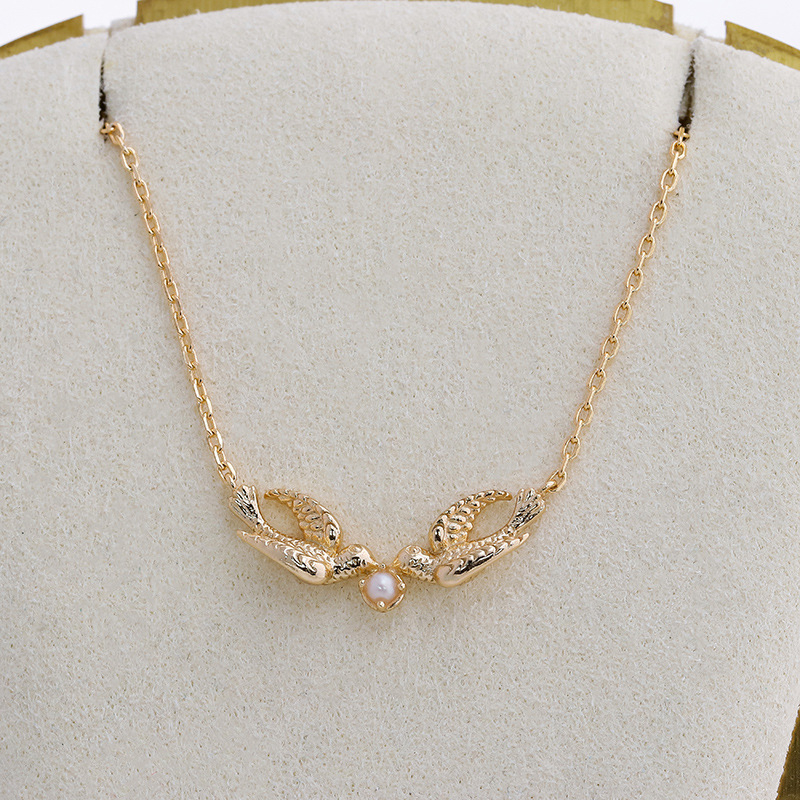 Ogrlica Dunli Jewelry s majčinom bisernom školjkom, elektroplating, motiv ptice, lanac križanja