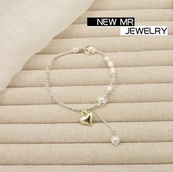 Barokna narukvica od slatkovodnih bisera sa srcolnim srebrnim perlicama i resicom – ženski modni nakit