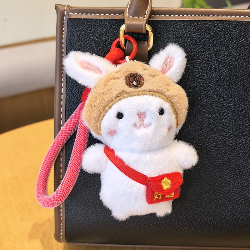 Csörgős plüssnyuszi táskadísz és kulcstartó — rajzfilmszerű, aranyos motívumokkal