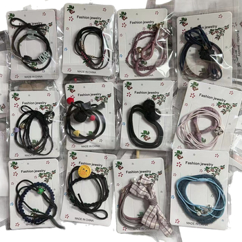 Hajgumi lófarokhoz, kézzel készített, anyag: zsinór, tél 2023, fejfedő kiegészítő