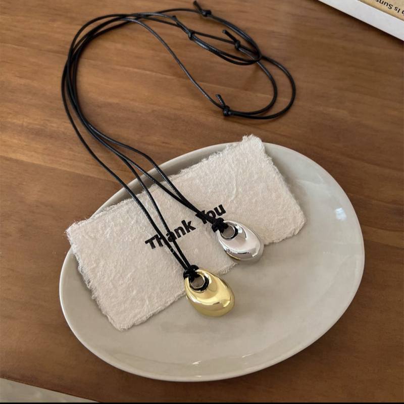 Bakreno ogrlica s PU užetom, privjesak u obliku graha, nepravilni dizajn, duljina 71–80 cm, niša stil, jesen 2024