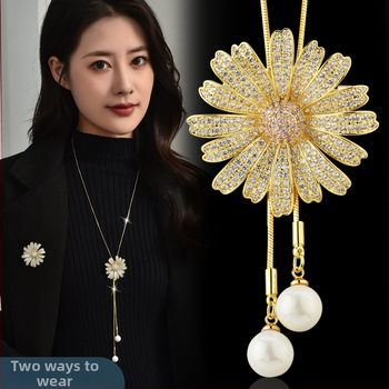 Ilgs džempera kakla ķēde ar ziedu motīva piekariņu, metāla ķēde, pallādija piekariņš, iekšēji iedobāti mākslīgie akmeņi