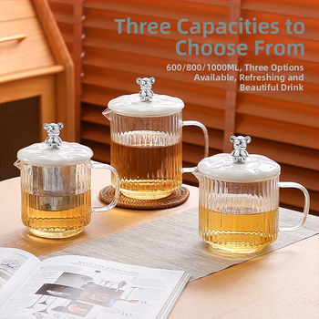 Veselības tējas kanna no stikla ar smilšu tekstūras korpusu (1 L ietilpība; 220 V; 300–350 W; keramikas iekšējā tvertnes; šķidruma izplešanās termostats)