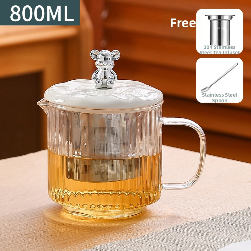 Veselības tējas kanna no stikla ar smilšu tekstūras korpusu (1 L ietilpība; 220 V; 300–350 W; keramikas iekšējā tvertnes; šķidruma izplešanās termostats)