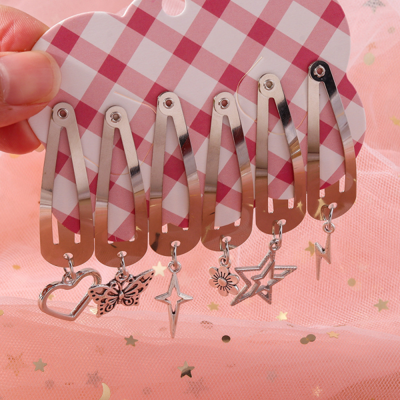 6 darabos hajcsat készlet csillag, szív, pillangó, virág és villám medállal – ötvözet, elektroplattázott felület, egyenként csomagolva