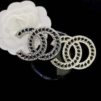 Broš od legure s natpisima, valovima i geometrijskim elementima, elektroplatiranje