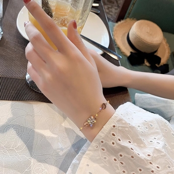 Sieviešu rokassprādze – titāna tērauds, diamanētu apdare, romiešu ciparu dizains, influencer stils, Zhirou zīmols