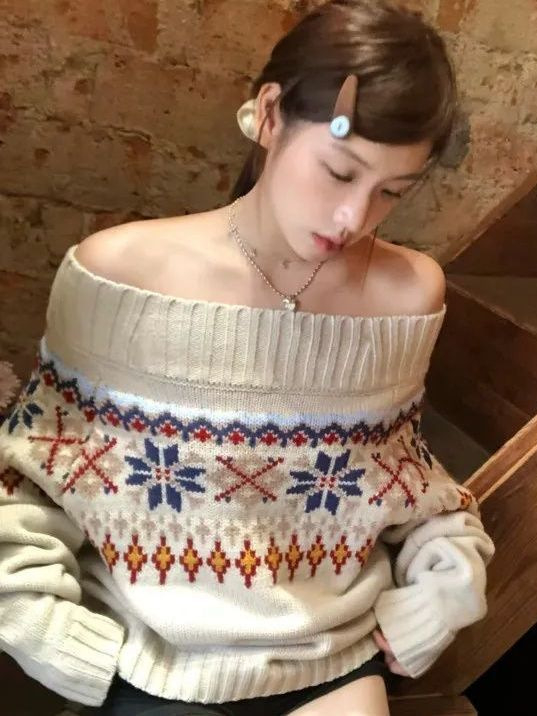 Ženski pleteni džemper Fair Isle s izrezom preko ramena, jacquard u blokovima boja, udoban širok kroj, dugi rukav.