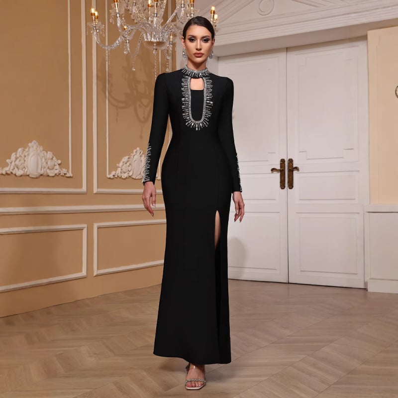 Duga večernja haljina s dugim rukavima, uski kroj, ukrašena perlicama i zatvaračem, materijal poliester-elastan.