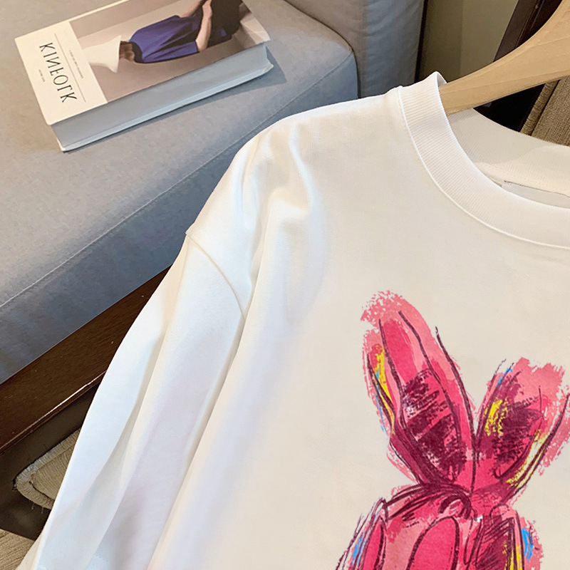 Unisex pamukasta T-majica s kratkim rukavima, okrugli izrez, slobodan kroj, tekstni uzorak.