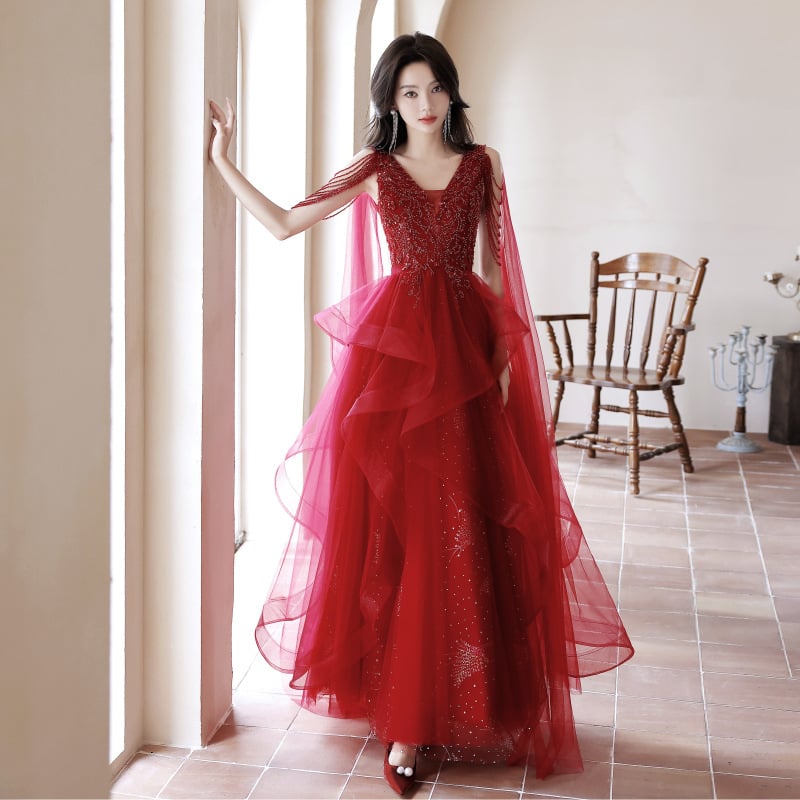 Crvena večernja haljina, duboki V-izrez, bez rukava, A-liniijski kroj, duga suknja, visok struk