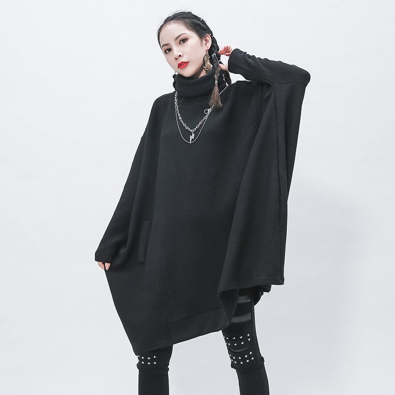 Kötött garbónyakú ruha, cocoon sziluett, szabálytalan midi szoknya, hosszú ujjú, laza derék – viszkóz alapú kötött anyag 50–70% akril keverék