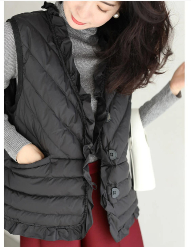 Pulover bez rukava s punom od pamuka i ovčije kože kao sekundarnim materijalom, dugačkog kroja, glavni materijal 90-95% pamuka.