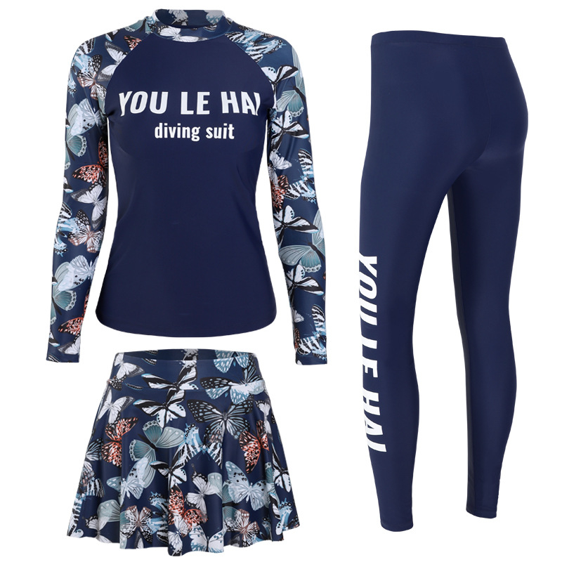 Ženski troslojeni kupaći kostim s dugim rukavima i dugim hlačama, donji dio u stilu suknje, cvjetni uzorak