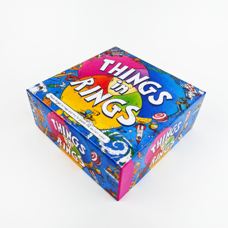 Things in Rings — επιτραπέζιο παιχνίδι λέξεων και αινίγματος για πάρτι, με κάρτες από χαρτί, για 2–6 παίκτες, 14+